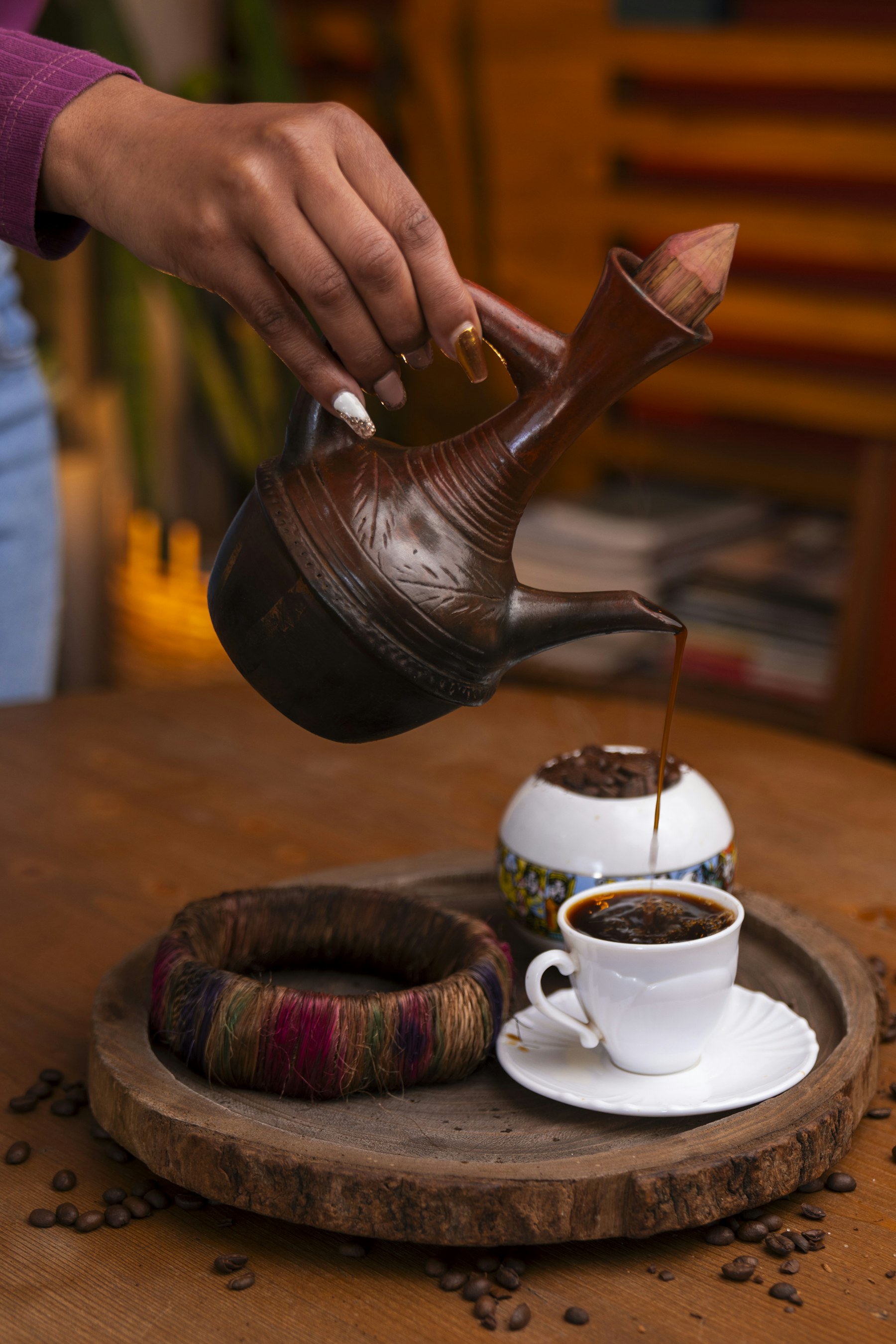 Ethiopian coffee being poured from a traditional pot